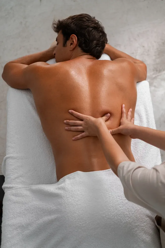 Professional male therapist providing premium doorstep massage services for relaxation at home or hotel in Delhi NCR.