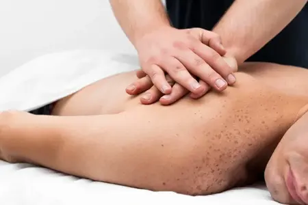 Deep tissue male massage therapy session targeting muscle tension in Delhi NCR