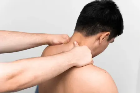 Male therapist performing deep tissue full body massage for muscle relaxation in Sainik Farms.