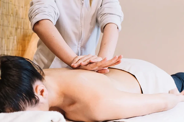 Relaxing home doorstep massage setup comparing convenient home service with traditional spa visits in Delhi