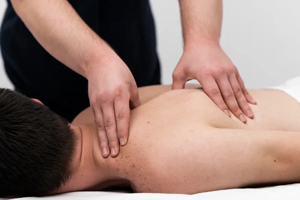 Experienced male massage therapist providing a professional full body massage session in Jamia Nagar, Delhi.