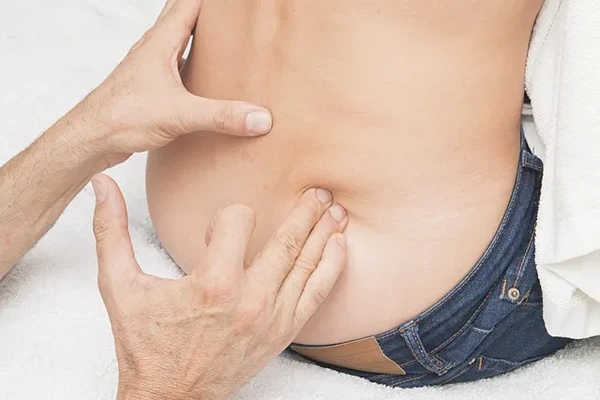 Experienced male therapist providing a professional home massage service in Lajpat Nagar, Delhi in a private setting.