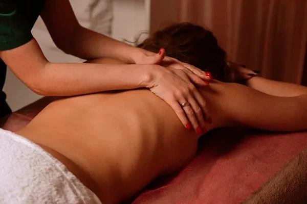 Experienced male therapist providing a professional home massage service in Mayur Vihar, Delhi in a private setting.