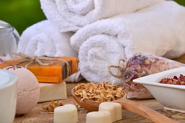 Clean and organized home massage setup with fresh linens and essential oils