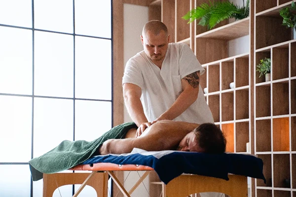 Professional male massage therapist providing doorstep male to male full body massage service in Noida home and hotel