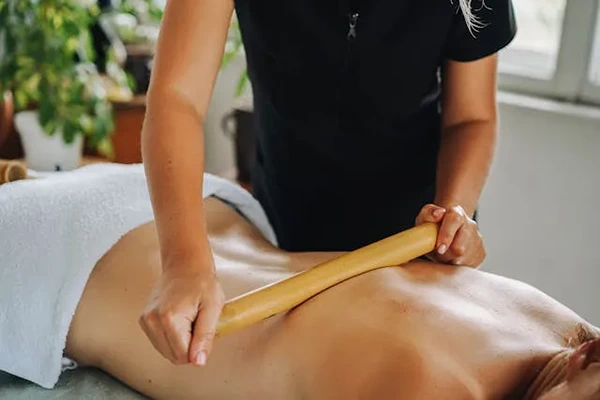 Professional male therapist providing a male to male full body massage service at a client's home in Okhla, Delhi.
