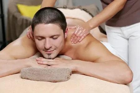 Relaxing Swedish massage therapy being provided by a professional male therapist in Connaught Place Delhi.
