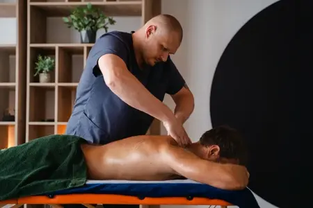 Deep tissue massage therapy session by professional male therapist for severe muscle tightness in Delhi NCR